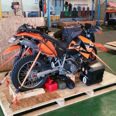 KTM motorbike strapped inside a wooden crate