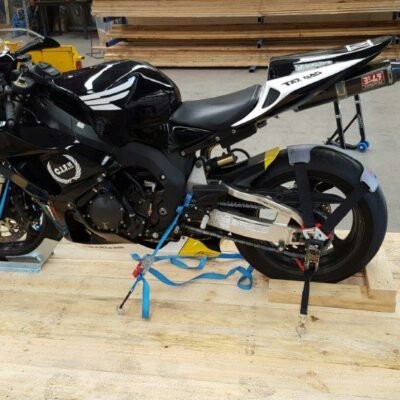 Sportsbike strapped on a wooden pallet, rear view