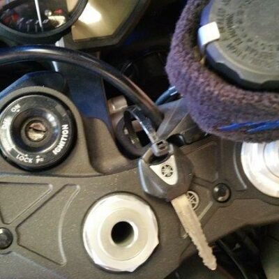 Close-up of a motorbike ignition switch with key